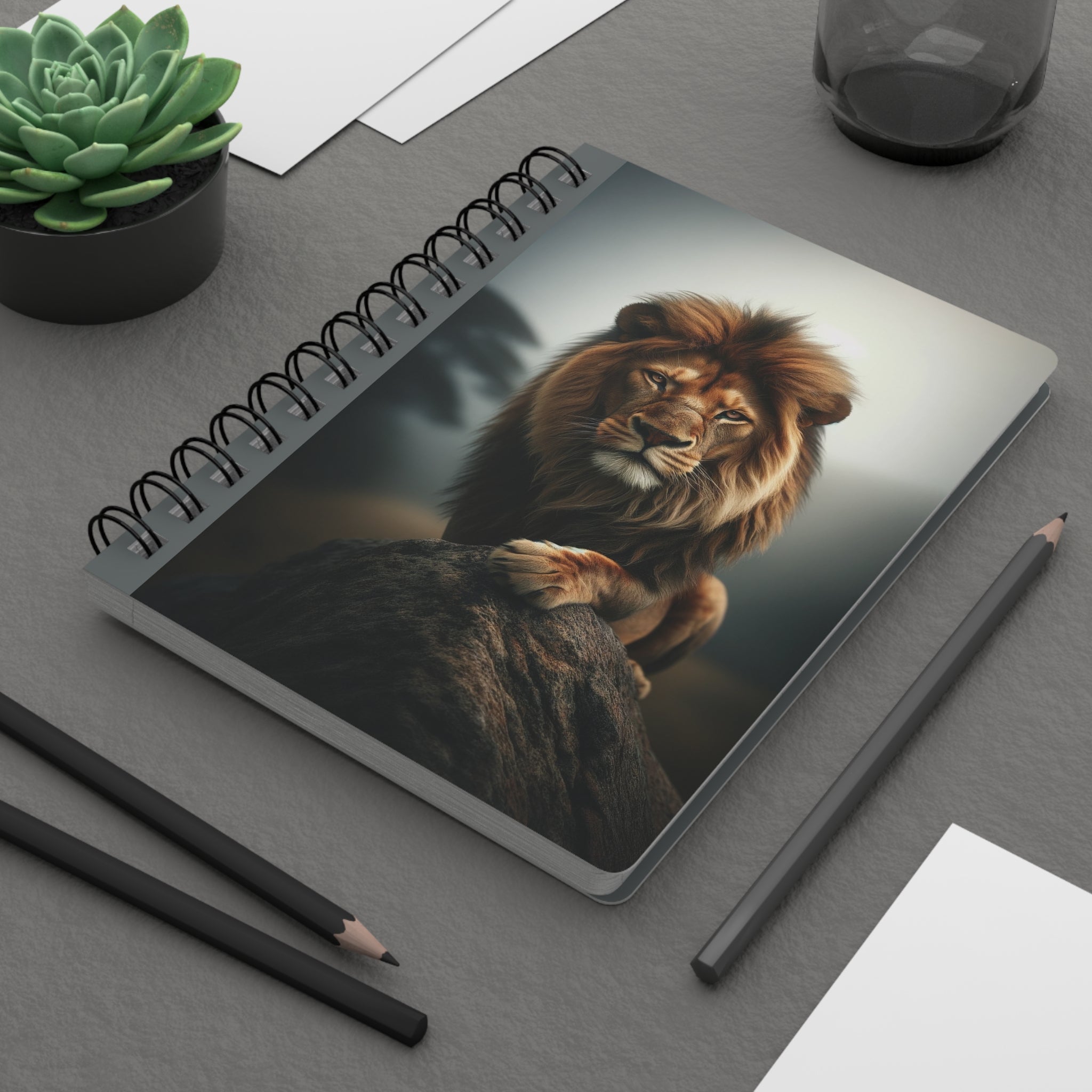 A lion on a rock - Spiral Notebook